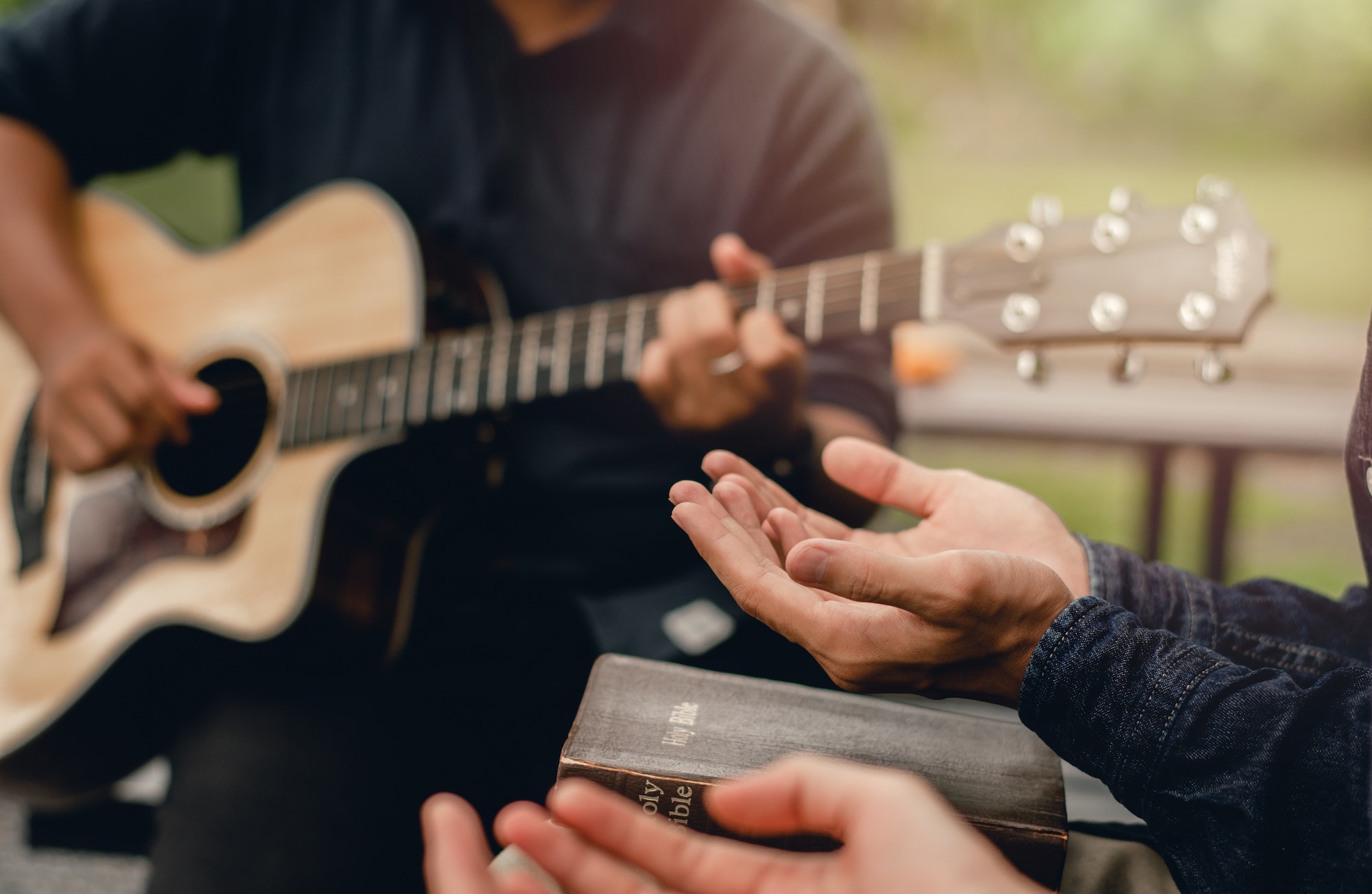 Christian Families Worshiping God Outdoors To relax life honoring God with a melodious guitar playin